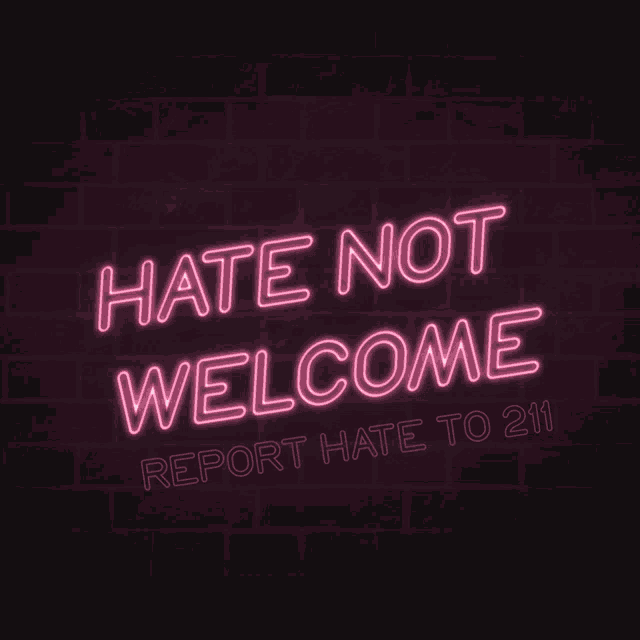 a neon sign that says hate not welcome