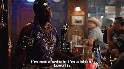 a man is standing at a bar talking to another man and saying i 'm not a snitch