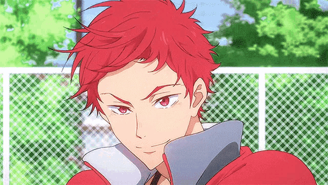 a close up of a person 's face with red hair and red eyes .