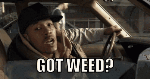 a man is driving a car and talking on a cell phone .
