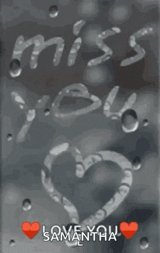 i miss you written on a window with a heart .
