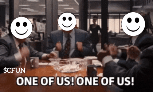 a group of men sitting around a table with smiley faces on their faces and one of them says one of us