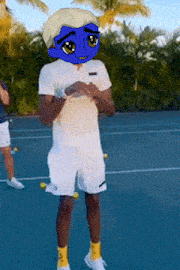 a person with a blue mask on their face standing on a tennis court