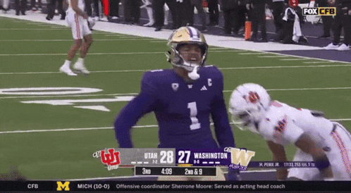 a football game between utah and washington