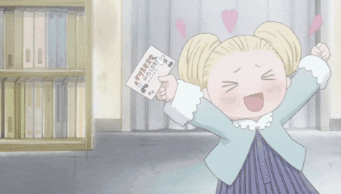 a girl in a blue jacket is holding a card that says ' a ' on it