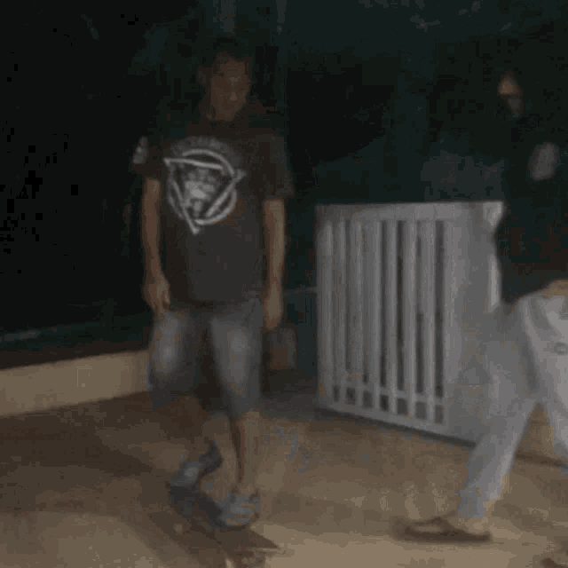 a man riding a skateboard wearing a shirt that says death throne