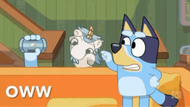 a cartoon dog is standing next to a stuffed animal with the word oww written on it