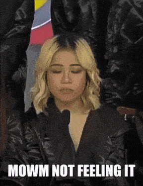 a woman with her eyes closed and the words " mowm not feeling it " below her