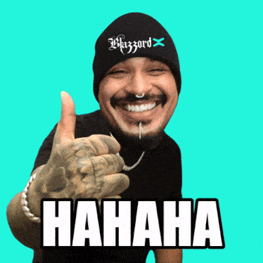 a man wearing a blizzard hat is giving a thumbs up sign