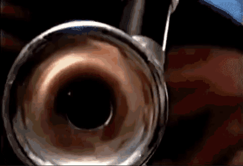a close up of a brass instrument with a blurred background
