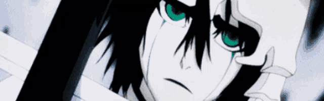 a close up of a person with green eyes