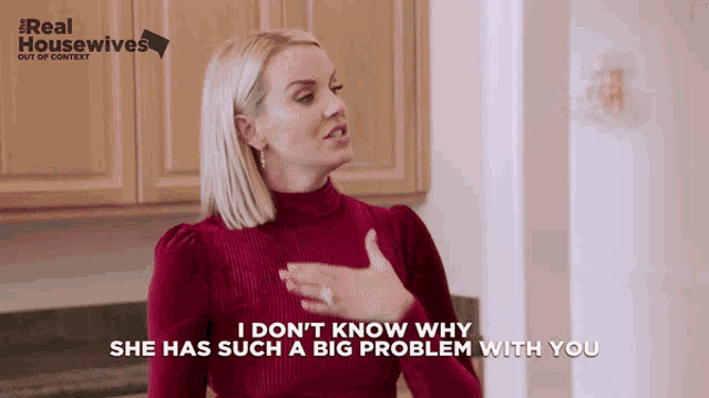 a woman in a red sweater says i don t know why she has such a big problem with you