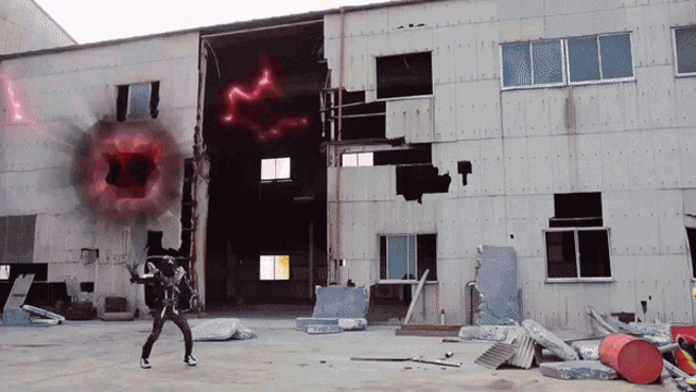 a man is standing in front of a building that has a hole in the wall