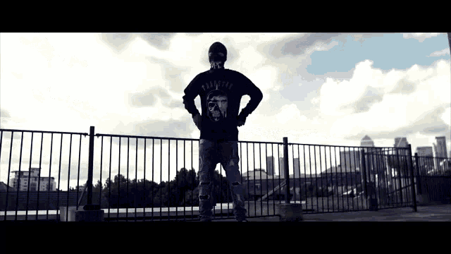 a man wearing a black sweatshirt that says rapture on the back