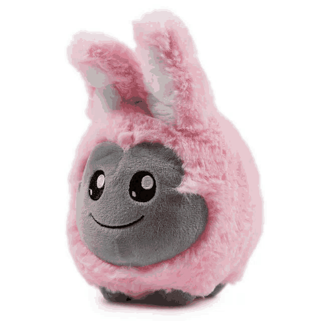 a pink stuffed animal with bunny ears and a face