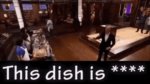 a man in a tuxedo is standing in front of a sign that says this dish is * * * *