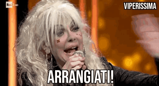 a woman singing into a microphone with the words arrangeati on the bottom right