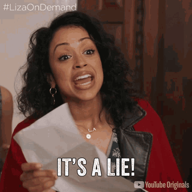a woman holding a piece of paper that says it 's a lie on it