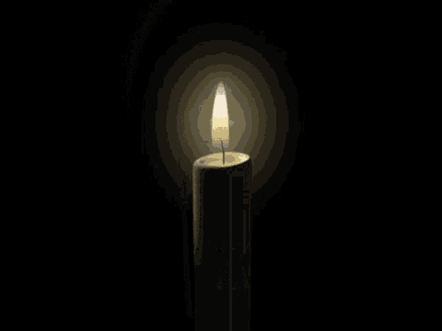 a candle with a picture of a man on it