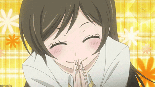 a girl is smiling with her hands folded in front of her face and the word mihatake is visible in the corner
