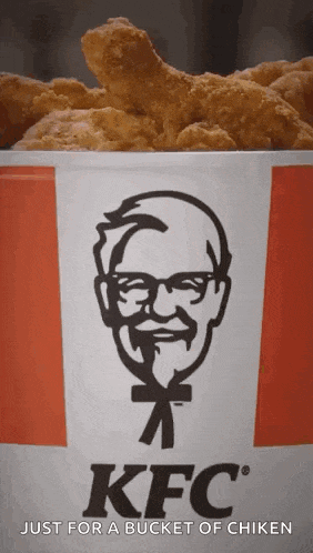 a bucket of kfc chicken with a man 's face on it .