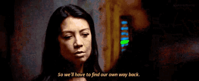 a woman is talking to a man in a dark room and says `` so we 'll have to find our own way back ''