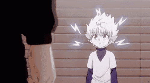 a young boy with white hair and lightning bolts around his head is standing in front of a brick wall .