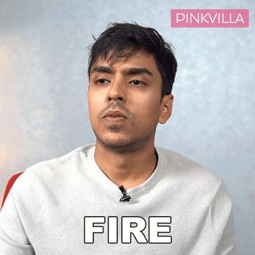 a man is wearing a white shirt with the word fire on it