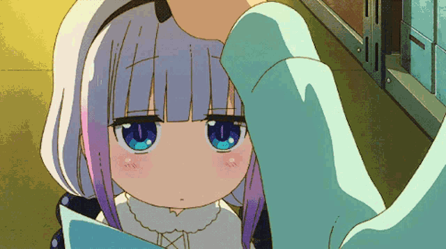 a girl with purple hair and blue eyes is being touched by someone