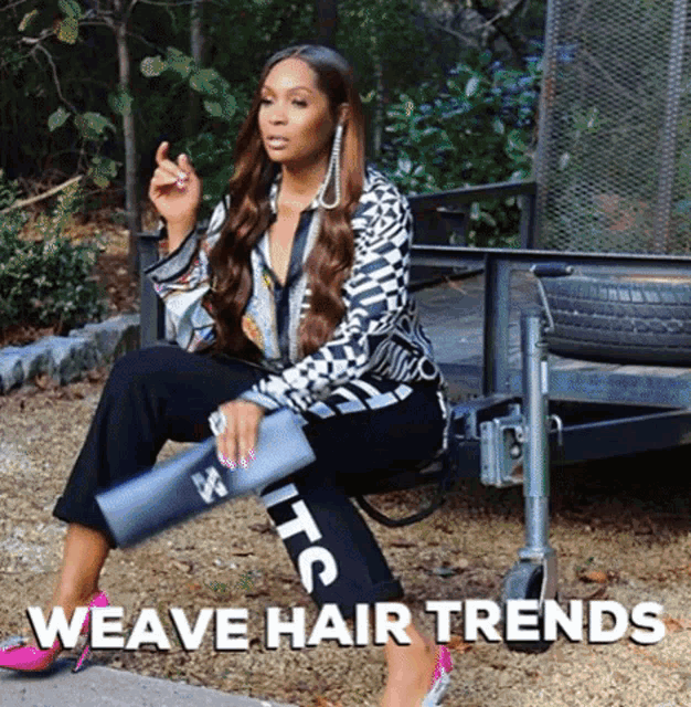 a woman is sitting on a trailer with the words weave hair trends written below her