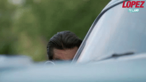 George Lopez Hiding From The Tour Bus GIF - George Lopez Spy Sneak GIFs