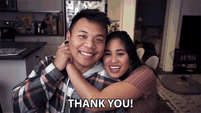 a man is hugging a woman with the words thank you written below them