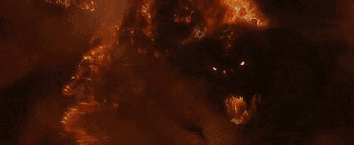 a close up of a monster 's mouth with a candle coming out of it .