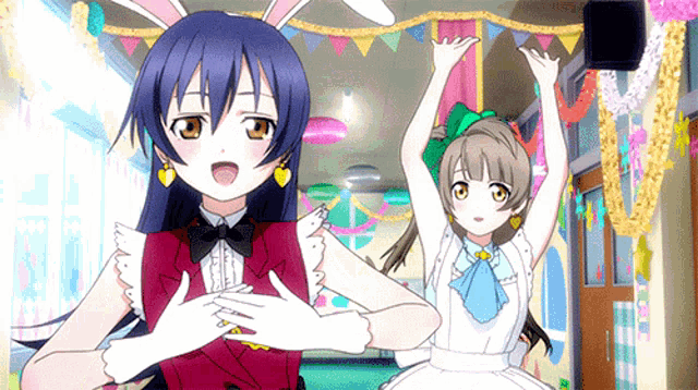 a couple of anime girls standing next to each other with their arms in the air