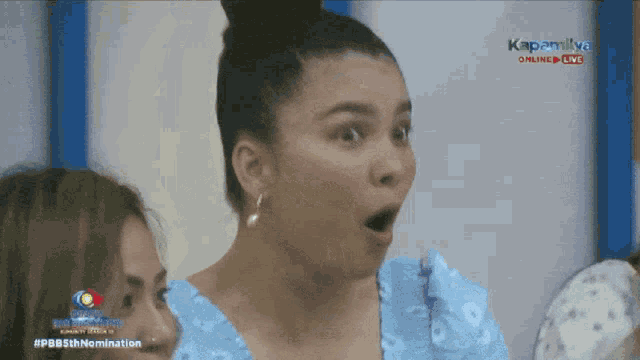 a woman with a surprised look on her face is on a television screen