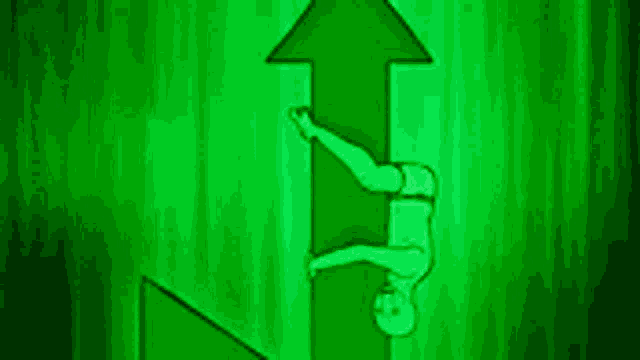 a person is hanging upside down on an arrow pointing upwards .