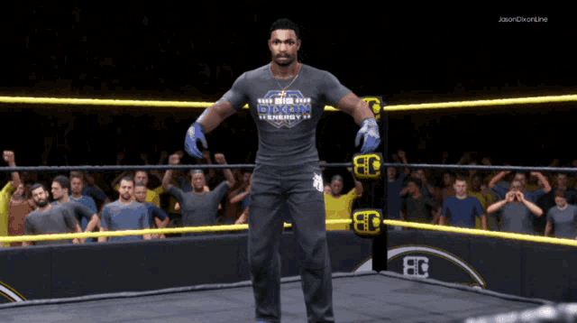 a man in a wrestling ring wearing a shirt that says ' reign over demon energy ' on it