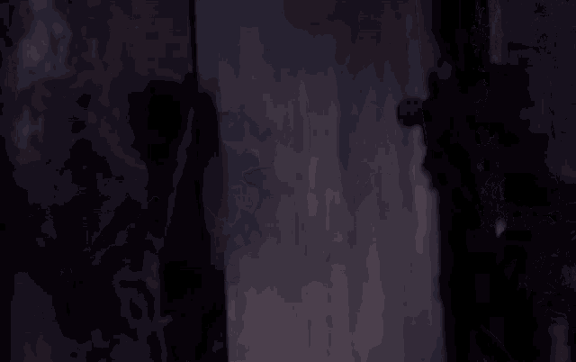 a woman wearing a red headlight is standing in a dark room