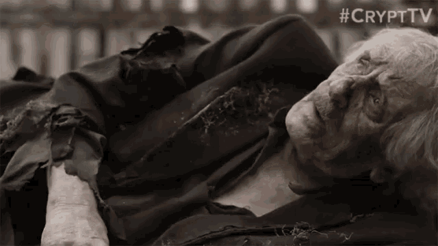 an old man is laying on the ground with the hashtag #crypttv