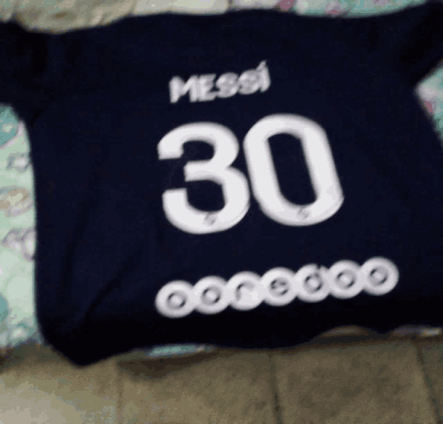 a black shirt with messi 30 on it