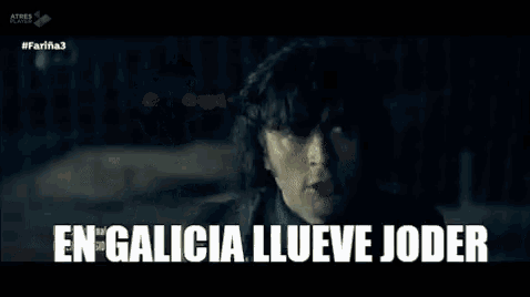 a man with a beard is standing in a parking lot at night and says `` en galicia llueve joder '' .