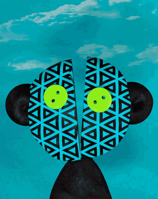 a monkey with a blue and black pattern on its face