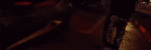 a close up of a film strip with a red and green colored background