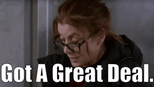 a woman wearing glasses and a black jacket with the words got a great deal below her