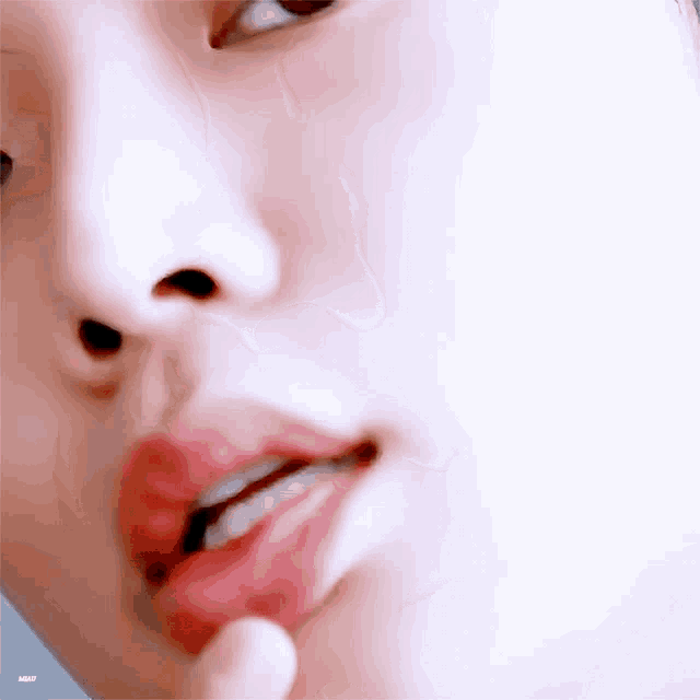 a close up of a person 's face with their mouth open