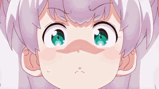 a close up of a person 's face with a surprised look on their face