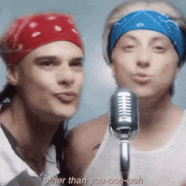 a man and a woman singing into a microphone with the words other than you-oon-ooh written below them