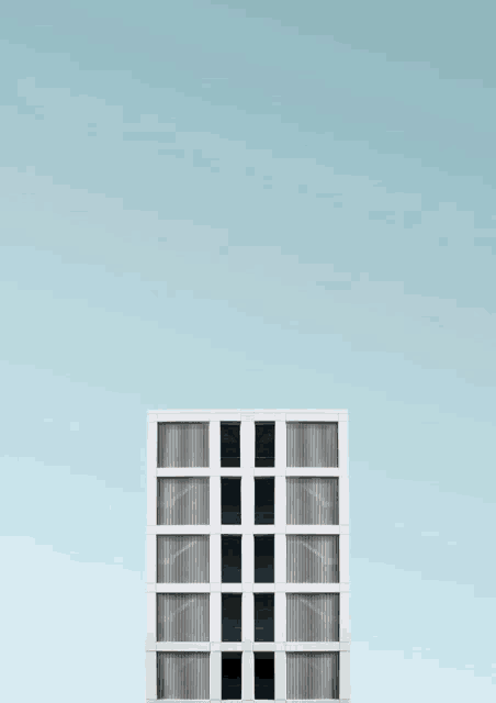 a cartoon boy standing on top of a building with the name malik on it
