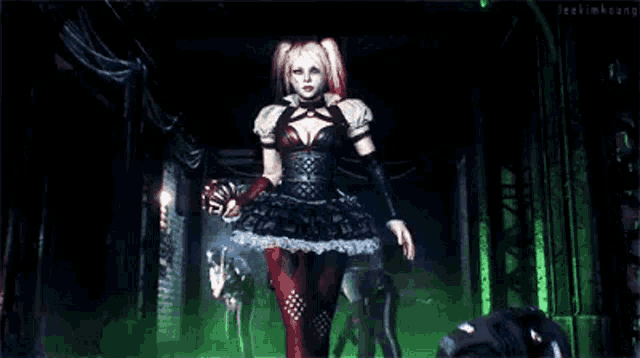 a woman in a harley quinn costume is standing in a dark room holding a ball .