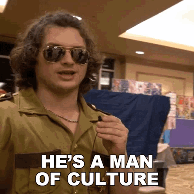 a man wearing sunglasses and a military uniform is saying he 's a man of culture
